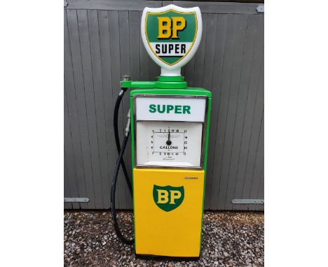 An original 1950s Beckmeter M50 petrol pump in BP livery, with a new glass globe, lighting and a replacement hose. The panels