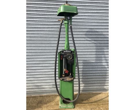 A Bowser hand-operated petrol pump with hose and nozzle.