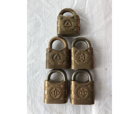 Five Shell and BP brass padlocks. 