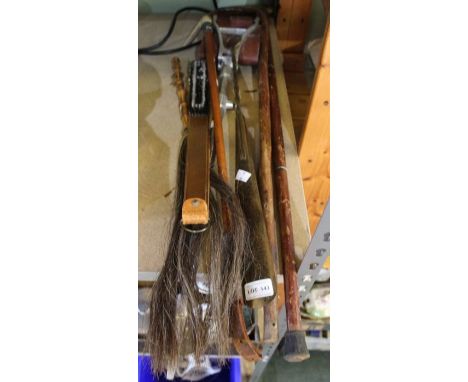A stag horn handled riding crop with fox mask ferule, shooting stick, fly swish, two other sticks, brass shoe horn and clothe