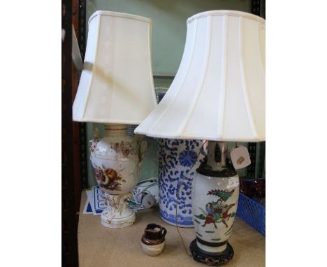 A blue &amp; white pottery stick stand, and two table lamps with shades