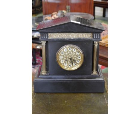 A Victorian black slate mantel clock, architectural pediment, gilt metal frieze, fretworked gilt metal on enamel dial, Arabic