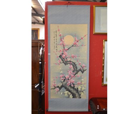 A Chinese scroll, decorated with blossoming prunus