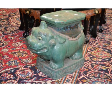 A ceramic jardiniere stand, as a Dog of Fo, turquoise glaze, 39cm high