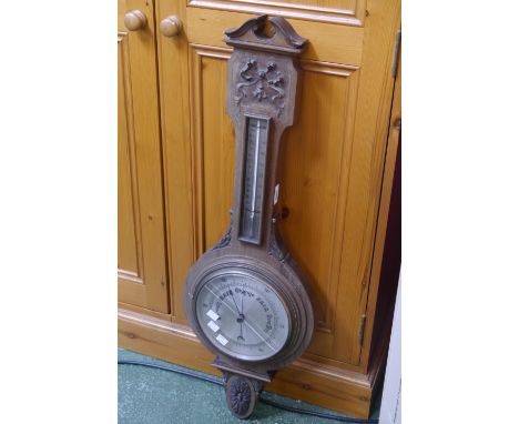 An Edwardian mahogany banjo barometer