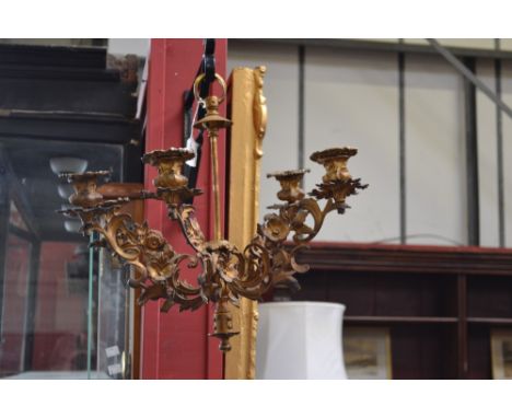 A 19th century ormolu five-light chandelier, posted suspension loop, campana sconces and branches cast with scrolling acanthu