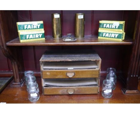 A Winel oak fronted stationery cabinet; four double pack Vintage Fairy soap tablets; two brass military aero engine starter c