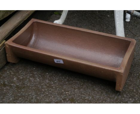 A salt glazed dog watering trough 48.5 cm long