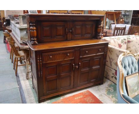 An Ercol court cupboard