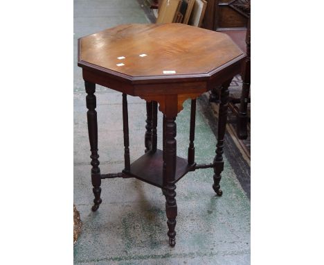 A Victorian mahogany octagonal occasional table, columned under tier, turned supports, ceramic castors