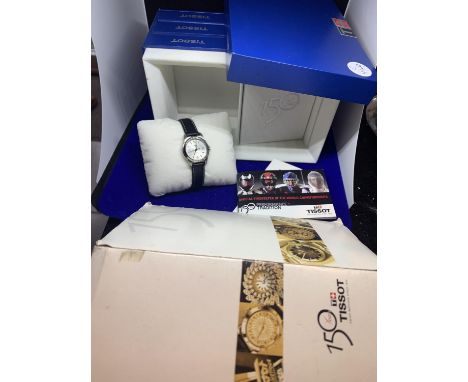 A TISSOT 150 YEARS LADIES WATCH IN PRESENTATION BOX WITH THE HISTORY OF TISSOT BOOK ETC 