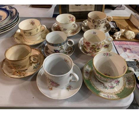 A COLLECTION OF EIGHT EARLY CERAMIC JUMBO CUPS AND SAUCERS 