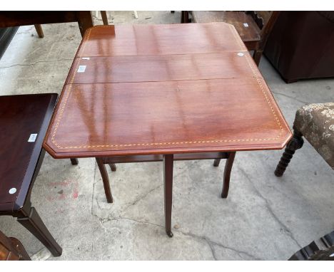 AN EDWARDIAN MAHOGANY AND INLAID SUTHERLAND TABLE 