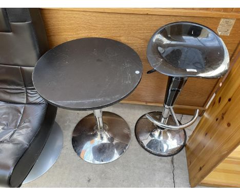 A BLACK PUMP ACTION KITCHEN STOOL ON CHROME BASE AND A SLIMLINE TABLE, 21" DIAMETER 