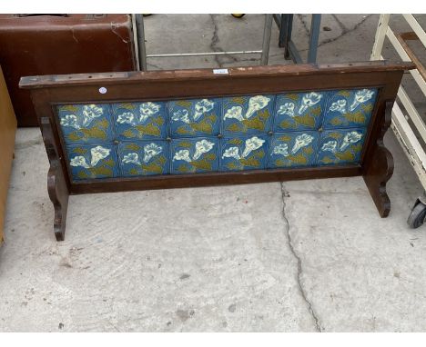 A VINTAGE DECORATIVE TILED BACK FROM A WASH STAND 