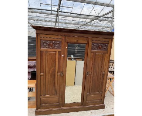 A LATE VICTORIAN MAHOGANY MIRROR DOOR WARDROBE WITH HANGING COMPARTMENT, DRAWERS ANS SLIDES 79 INCHES WIDE 