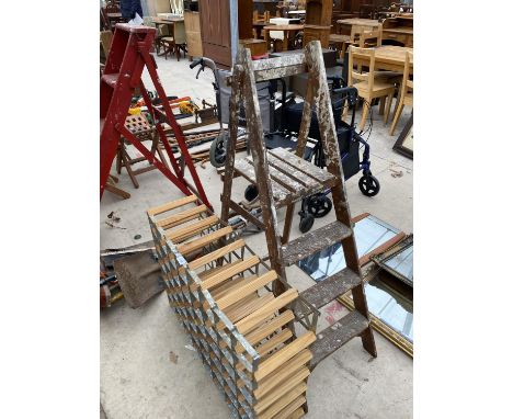 A SET OF VINTAGE WOODEN STEP LADDERS AND A WINE RACK 