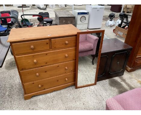 A PINE CHEST OF TWO SHORT AND THREE LONG DRAWERS, PINE MIRROR AND MAHOGANY EFFECT BASE 