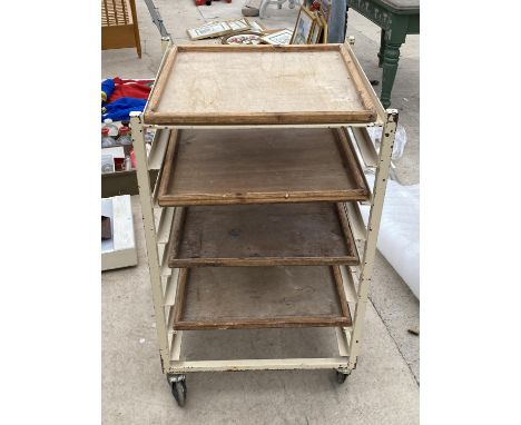 A VINTAGE POTTERS TROLLEY WITH FOUR SHELVES 