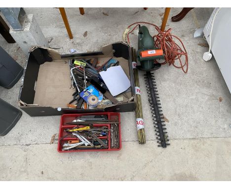 AN ASSORTMENT OIF TOOLS TO INCLUDE AN ELECTRIC HEDGE CUTTER AND SPANNERS ETC 