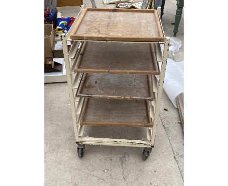 A VINTAGE POTTERS TROLLEY WITH FOUR SHELVES 