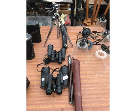TWO PAIRS OF BINOCULARS AND TWO CAMERA TRI-PODS 