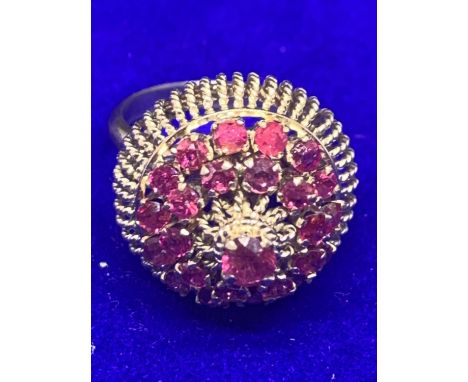 AN ORNATE 14 CARAT GOLD RING WITH TWENTY FIVE GARNETS SIZE K GROSS WEIGHT APPROXIMATELY 6.6 GRAMS 