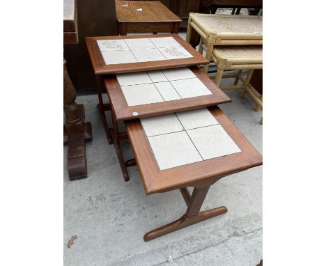 A NEST OF RETRO TEAK AND TILE INSET TABLES 