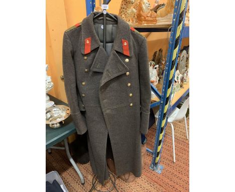 A VINTAGE SOVIET RUSSIAN ARMY GREAT COAT TO INCLUDE A STEEL STAND 