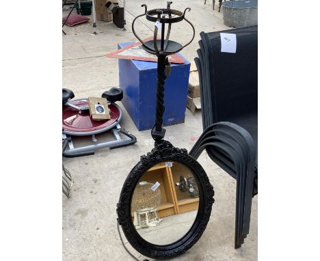 AN ORNATE WROUGHT IRON LAMP AND A DECORATIVE MIRROR 
