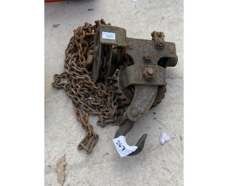 A VINTAGE HOOK AND CHAIN PULLY SYSTEM 