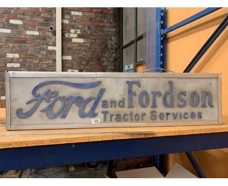 AN ILLUMINATED 'FORD AND FORDSON TRACTOR SERVICES SIGN' 
