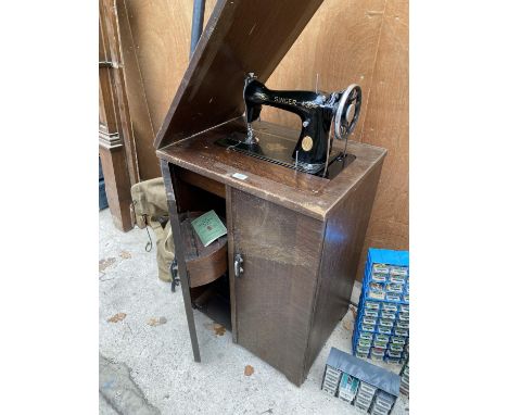 A VINTAGE SINGER SEWING MACHINE COMPLETE WITH CASE AND ORIGINAL FOOT PEDDLE AND INSTRUCTION MANUAL 