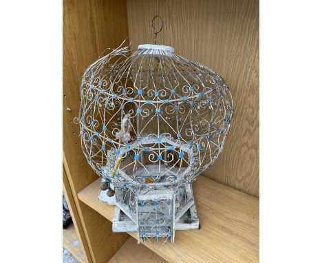 A VINTAGE AND ORNATE DECORATIVE BIRD CAGE 