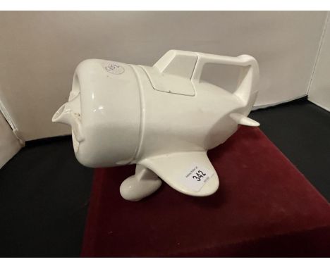 A RETRO 1978 WHITE CERAMIC VANDOR TEA POT IN THE FORM OF AN AEROPLANE 