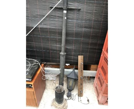 A VINTAGE OUTSIDE LIGHT WITH LAMP POST AND A COAT HOOK 