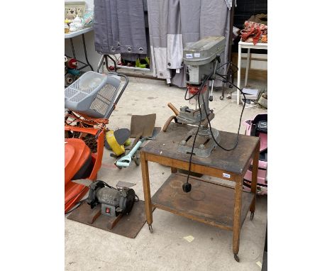A PILLAR DRILL ON A WHEELED TROLLEY AND A BENCH GRINDER 