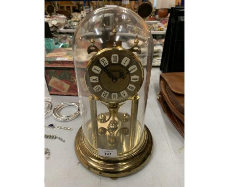 A BRASS HALLER DOMED MANTLE CLOCK 