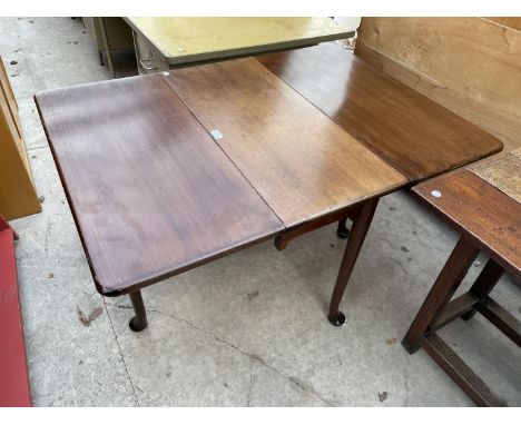 A 19TH CENTURY MAHOGANY DROP-LEAF DINING TABLE ON PAD FEET 