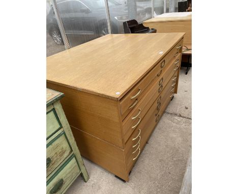 A LIGHT OAK EIGHT DRAWER JUMBO PLAN CHEST, 52" WIDE 