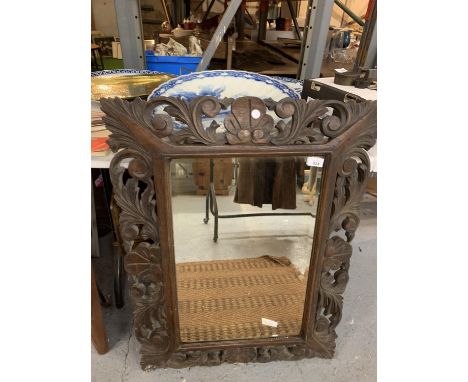 A LARGE WOODEN CARVED FRAMED MIRROR 90CM X 66CM 