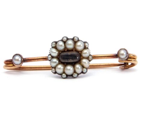 Mourning bar brooch, the centre an oval glazed plaited hair panel within a seed pearl surround, each ends highlighted with a 