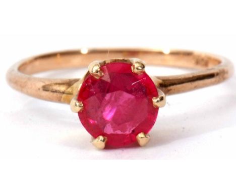 Modern synthetic ruby ring of circular faceted design, claw and coronet set in a plain 10K stamped mount, size L/K   