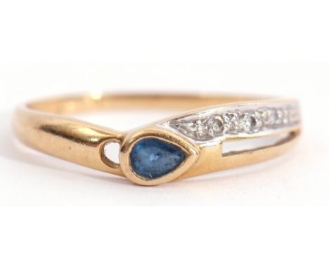 Modern sapphire and diamond ring, the pear shaped sapphire collet set highlighted with a pierced diamond set shoulder, stampe