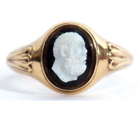 Antique carved hard stone ring, a head and shoulders carved figure of a bearded man applied to an oval black panel, bezel set