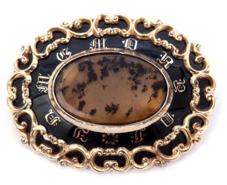Victorian mourning brooch, the oval centre a moss agate panel on a black surround decorated with gold letters and applied wit