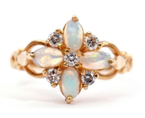 18ct gold opal and diamond cluster ring, featuring 4 oval cabochon opals highlighted with 5 small brilliant cut diamonds, all