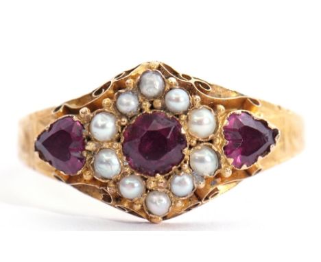 Antique 15ct gold, purple stone and seed pearl ring, the circular shaped centre stone within a surround of 8 grey graduated s