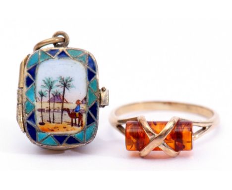 Mixed Lot: 9ct gold and amber ring, together with a silver gilt and enamelled locket pendant, the front decorated with a palm