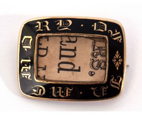Victorian mourning brooch of rectangular form, the surround a black translucent enamel inlaid with gold inscriptionm "In Memo